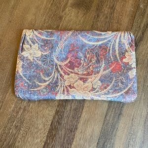 Blue, pink, beige-print fabric purse/clutch.